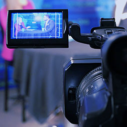 Camera view screen showing the reporters. Link to Gifts That Pay You Income